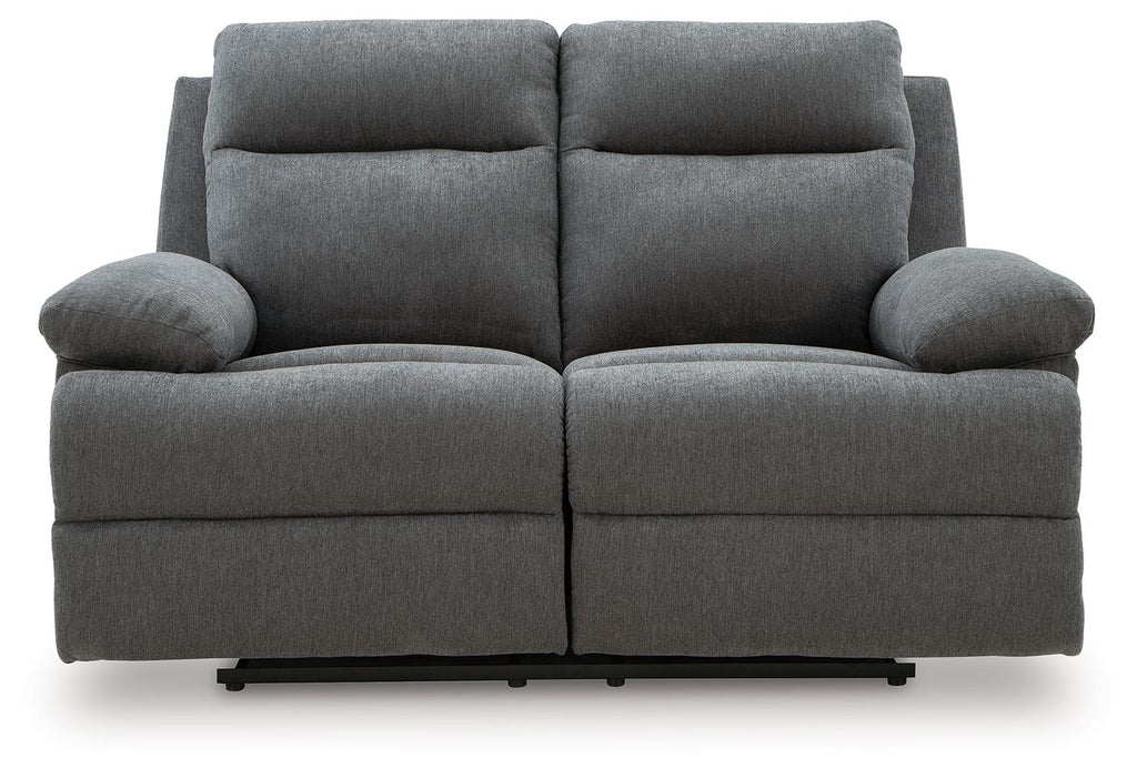 Dark gray reclining loveseat, front view with two headrests and cushioned back