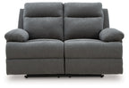 Dark gray reclining loveseat, front view with two headrests and cushioned back