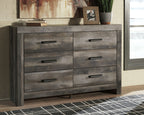 Gray wood dresser with four drawers and black bar pulls