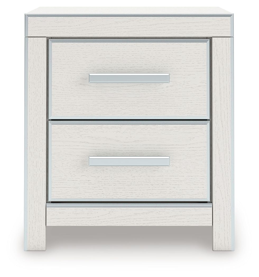 White two-drawer night stand with two silver bar handles and open drawer fronts