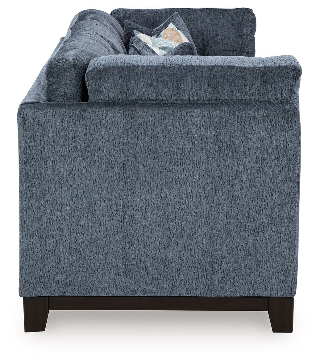 Navy fabric sofa with broad arms and visible cushions