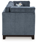 Navy fabric sofa with broad arms and visible cushions