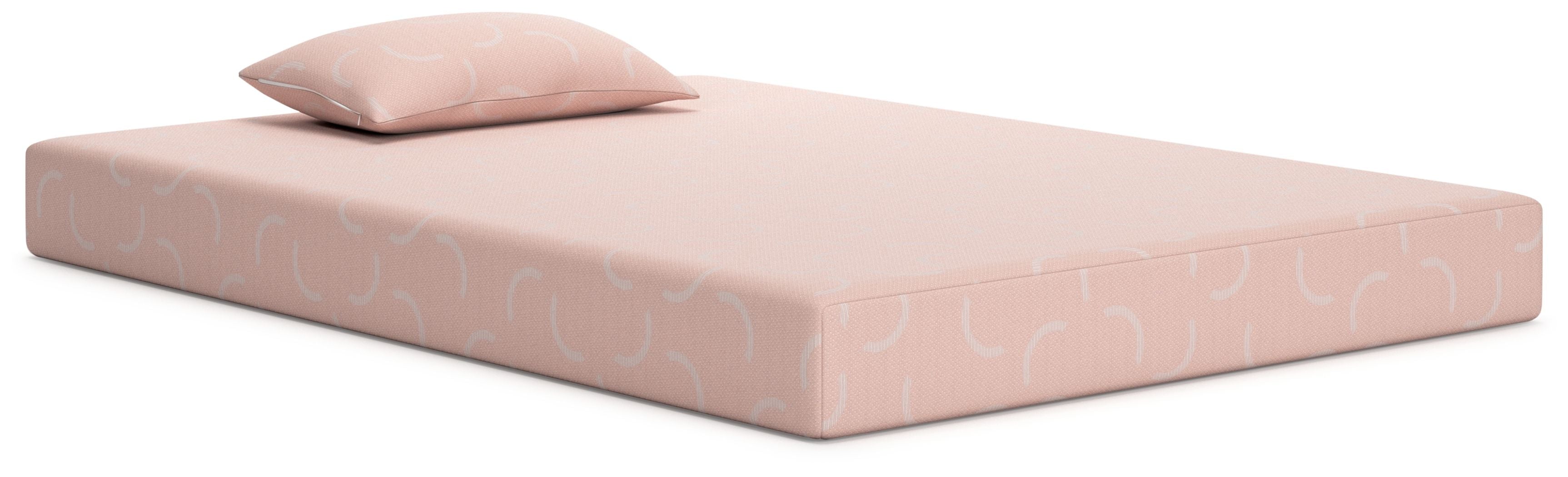 Kids mattress and pillow set, coral-pink with subtle pattern, neatly made