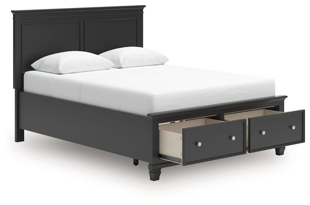 Black panel bed with two front drawers and a white upholstered mattress and pillows.