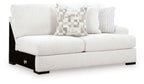 Chalk loveseat with three throw pillows and dark feet