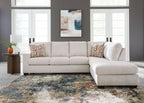 Light stone fabric sectional sofa with chaise and decorative patterned pillows