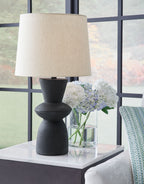 Black distressed paper table lamp with white fabric drum shade on black base