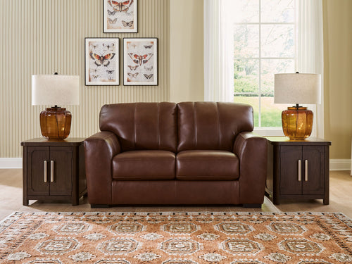 Brown leather-look loveseat with tufted back and centered two-seat design