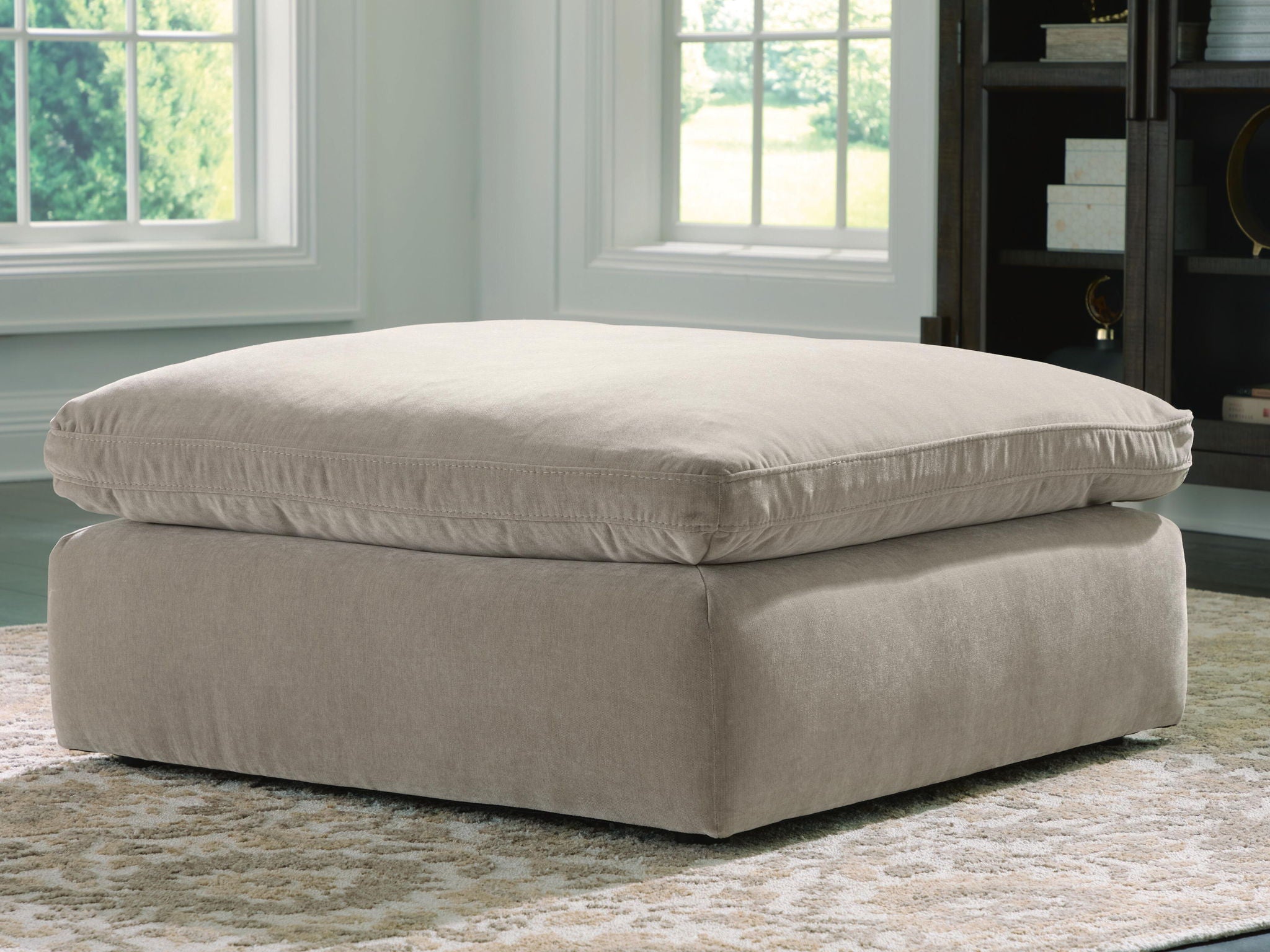 Oversized accent ottoman in light gray, square upholstered top and base