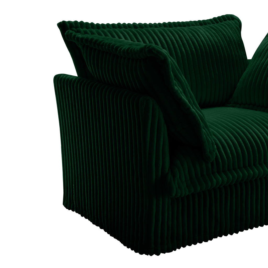 Green corduroy sectional chair with rounded arms and draped accent cushion