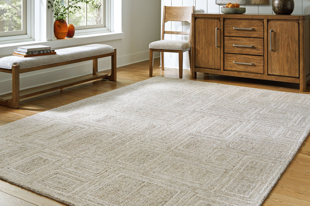 Gray area rug with textured geometric motif