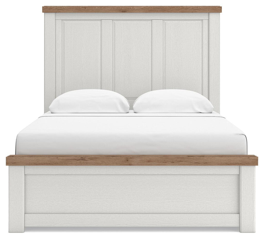 White panel bed frame with paneled headboard and light wood top rail