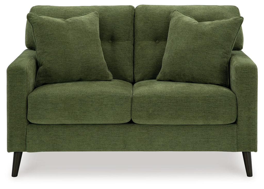 Green loveseat with tufted back, rolled arms, and two padded seat cushions.