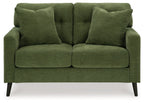 Green loveseat with tufted back, rolled arms, and two padded seat cushions.