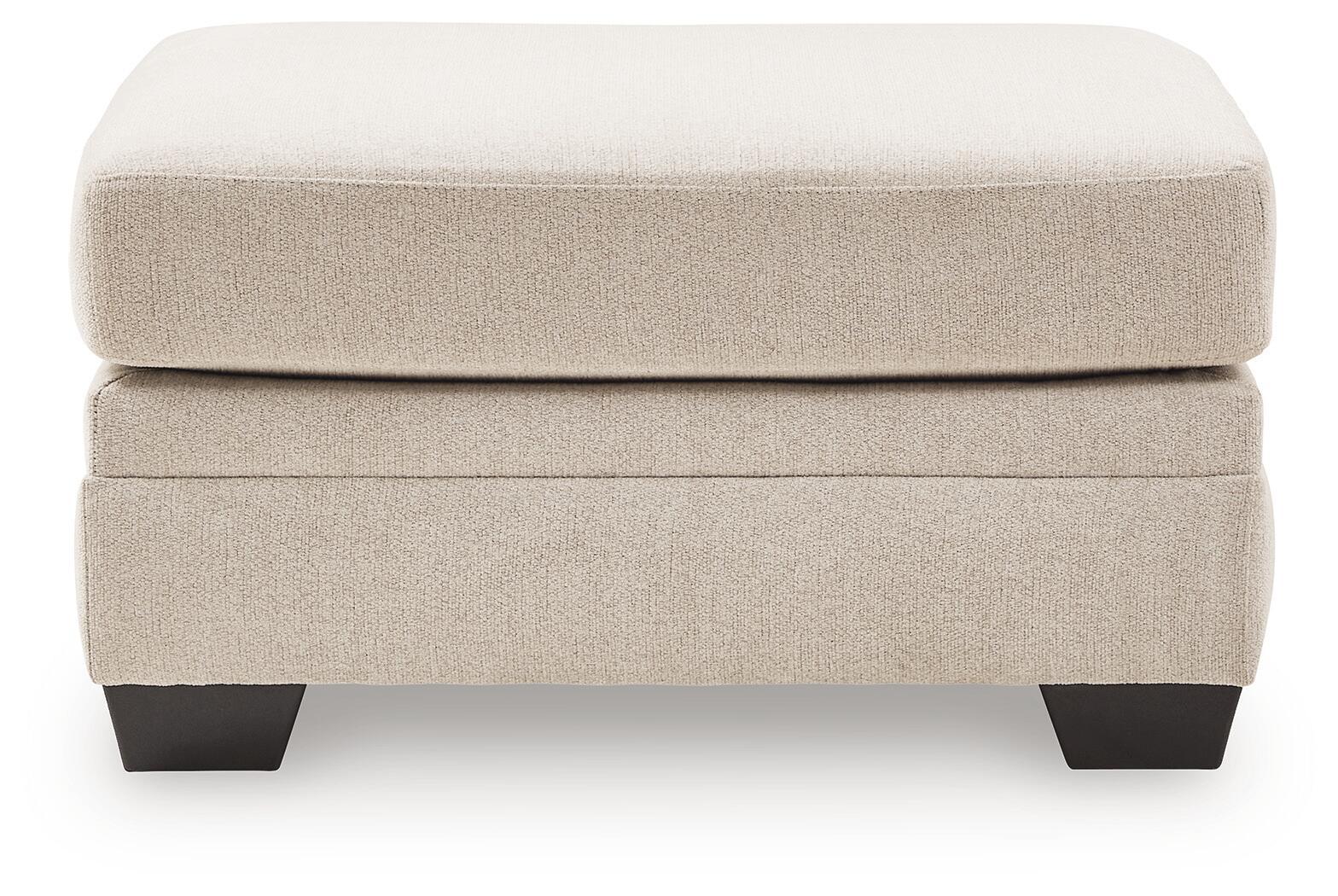 Beige upholstered ottoman with two-tier design and dark legs