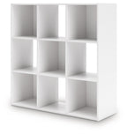 White cube storage organizer with open cubbies, angled view of the shelving unit