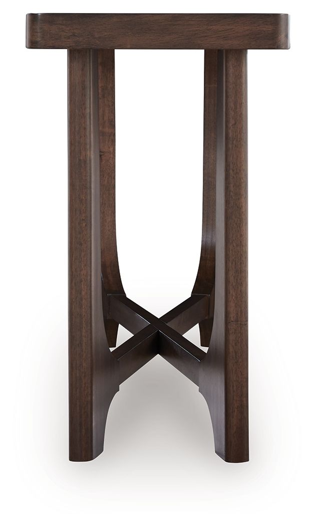 Dark brown rectangular cocktail table with arched underside and X-shaped support base