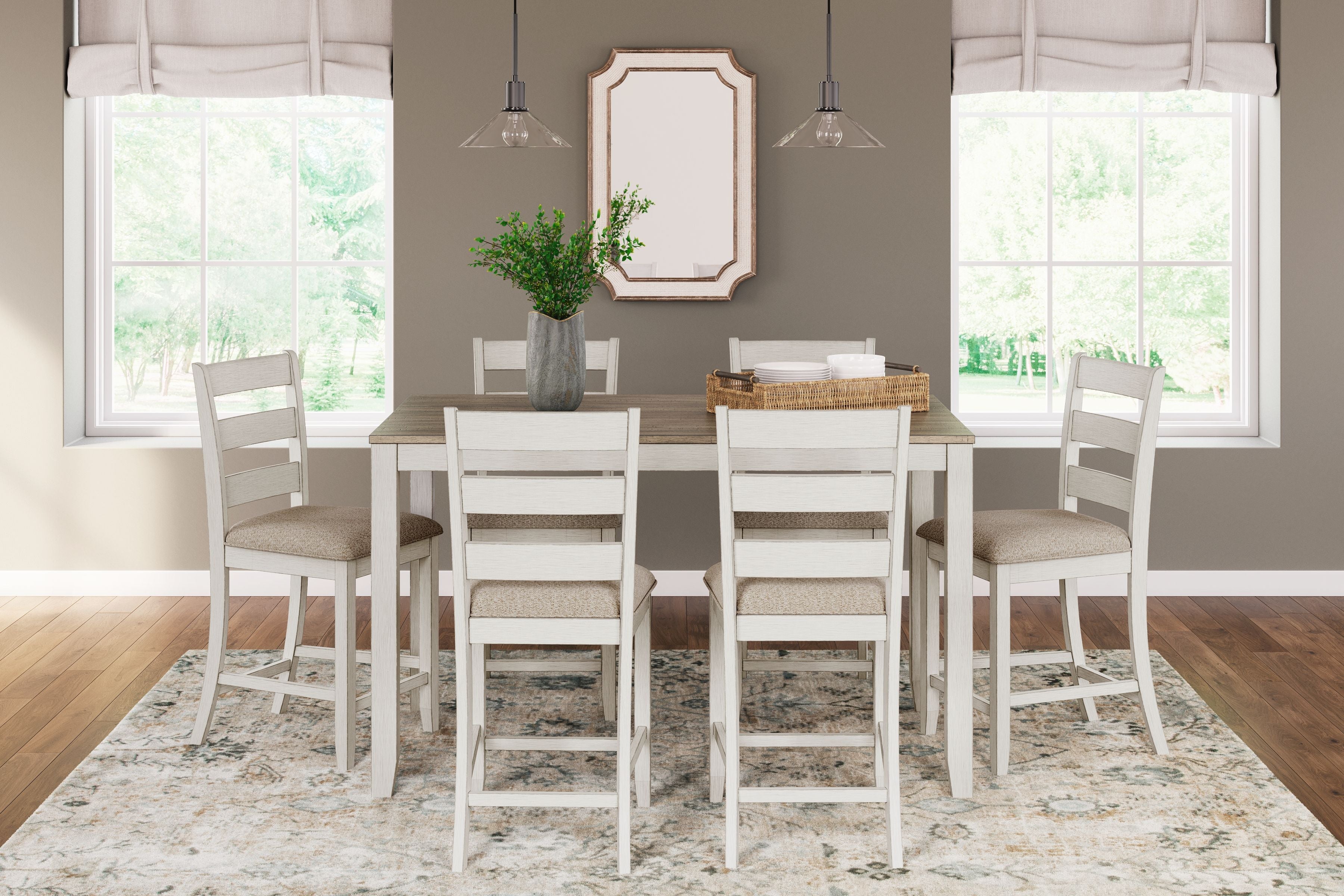 White counter-height dining table with light brown top and six bar stools with beige seats