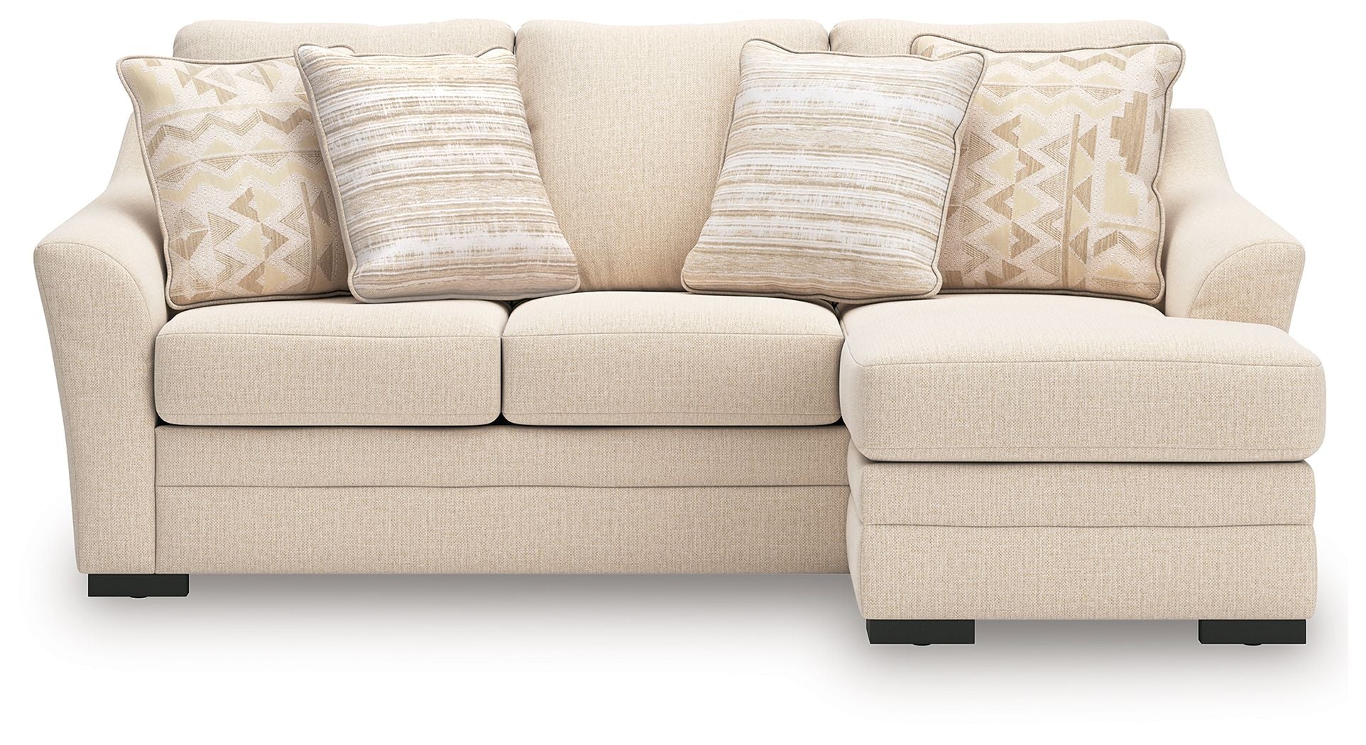 Queen sofa chaise sleeper in light beige with chaise section and set of patterned throw pillows