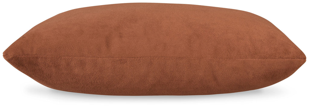 Light brown oblong throw pillow with textured fabric and smooth seams