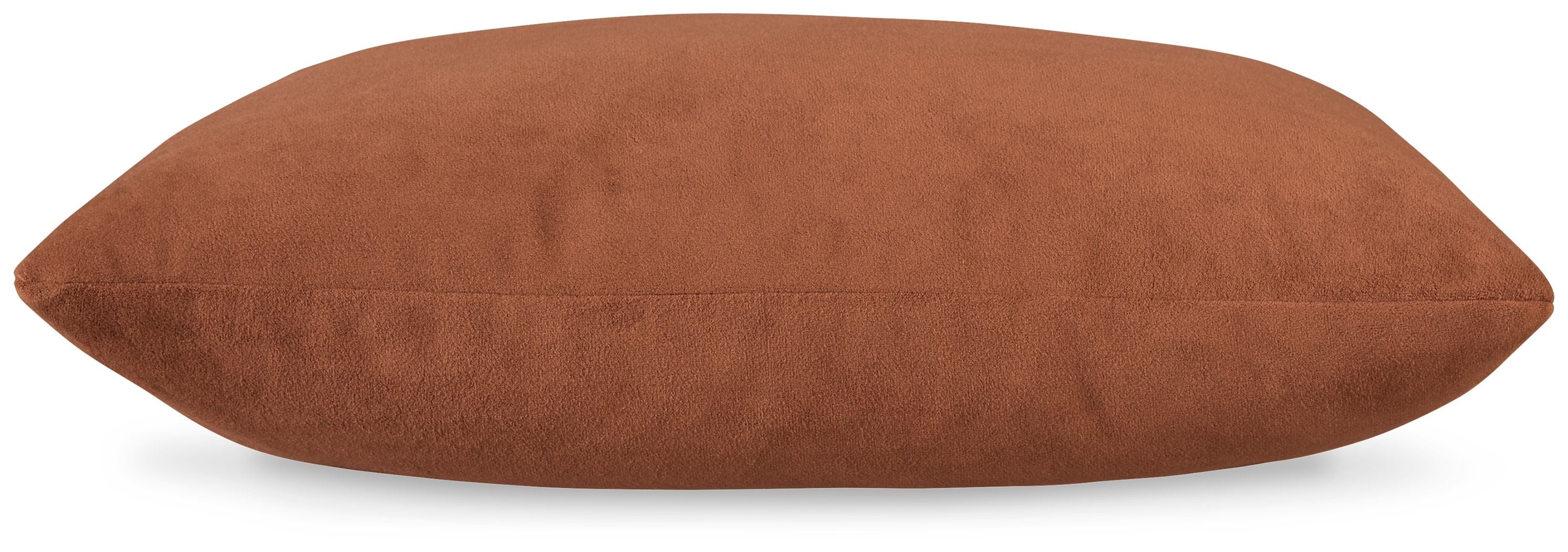 Light brown oblong throw pillow with textured fabric and smooth seams