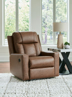 Caramel zero-wall recliner with tufted back, cushioned arms, and recline footrest