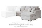 Two-tone sectional sofa with white left seat and light gray right chaise, throw pillows