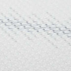White fabric mattress top with dotted gel-like texture