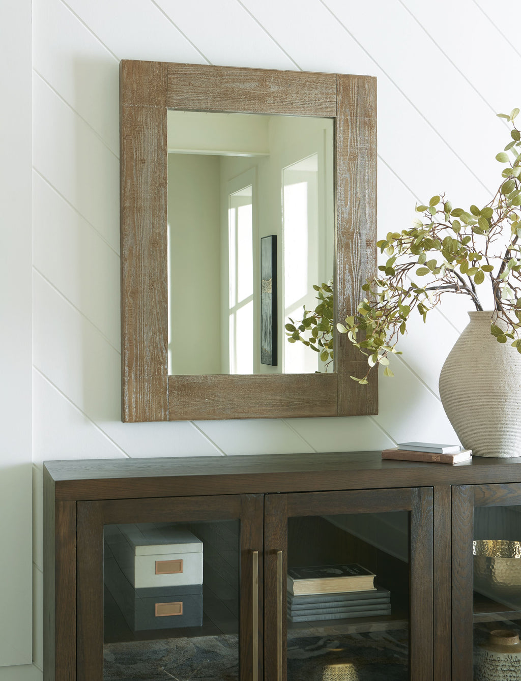 Distressed brown accent mirror with rectangular frame and clear glass