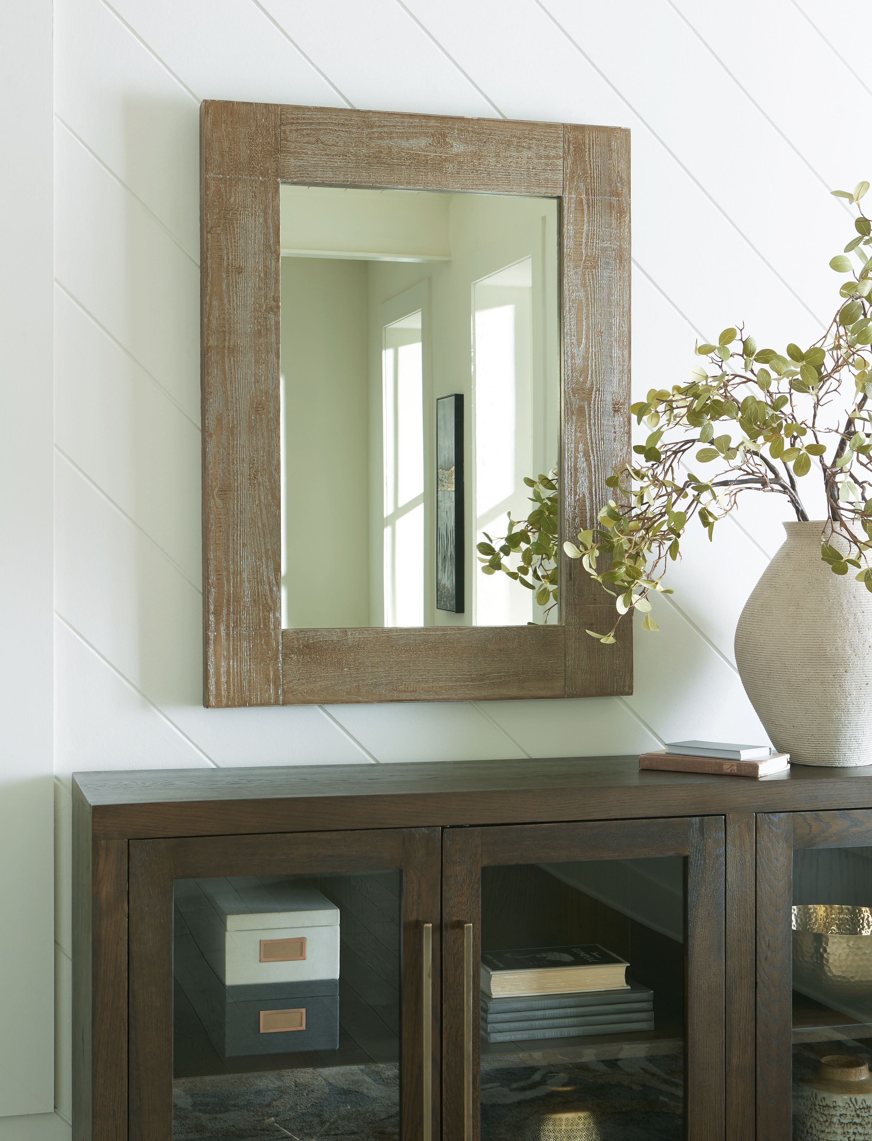 Distressed brown accent mirror with rectangular frame and clear glass