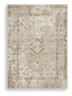 Washable rug with light brown distressed geometric medallion center and border