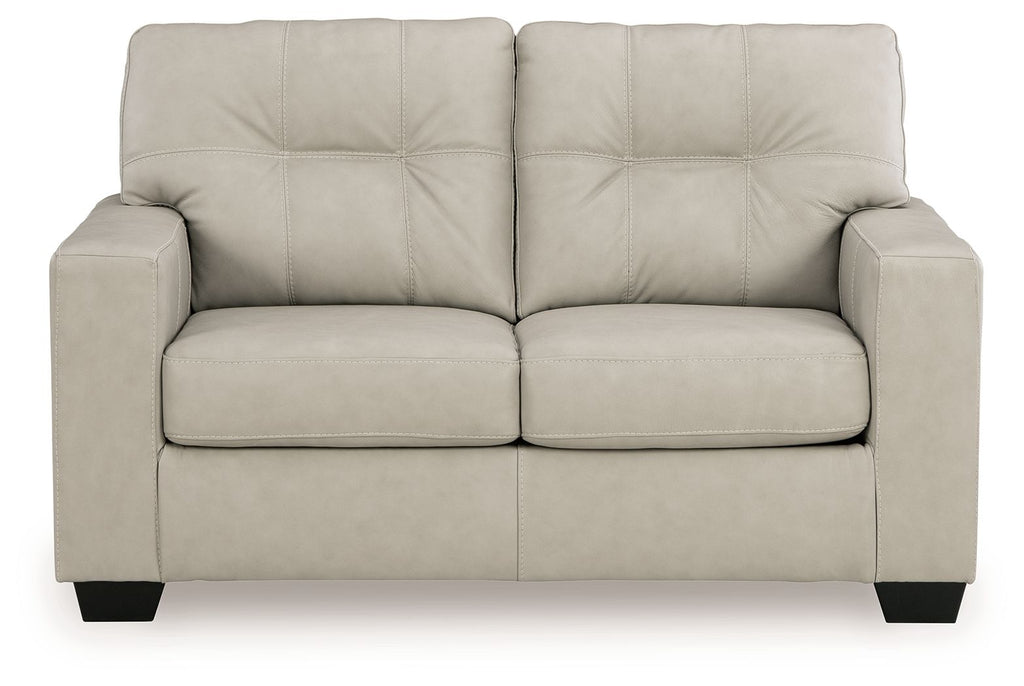 Light beige leather-look loveseat with tufted back and two padded seat cushions, square legs