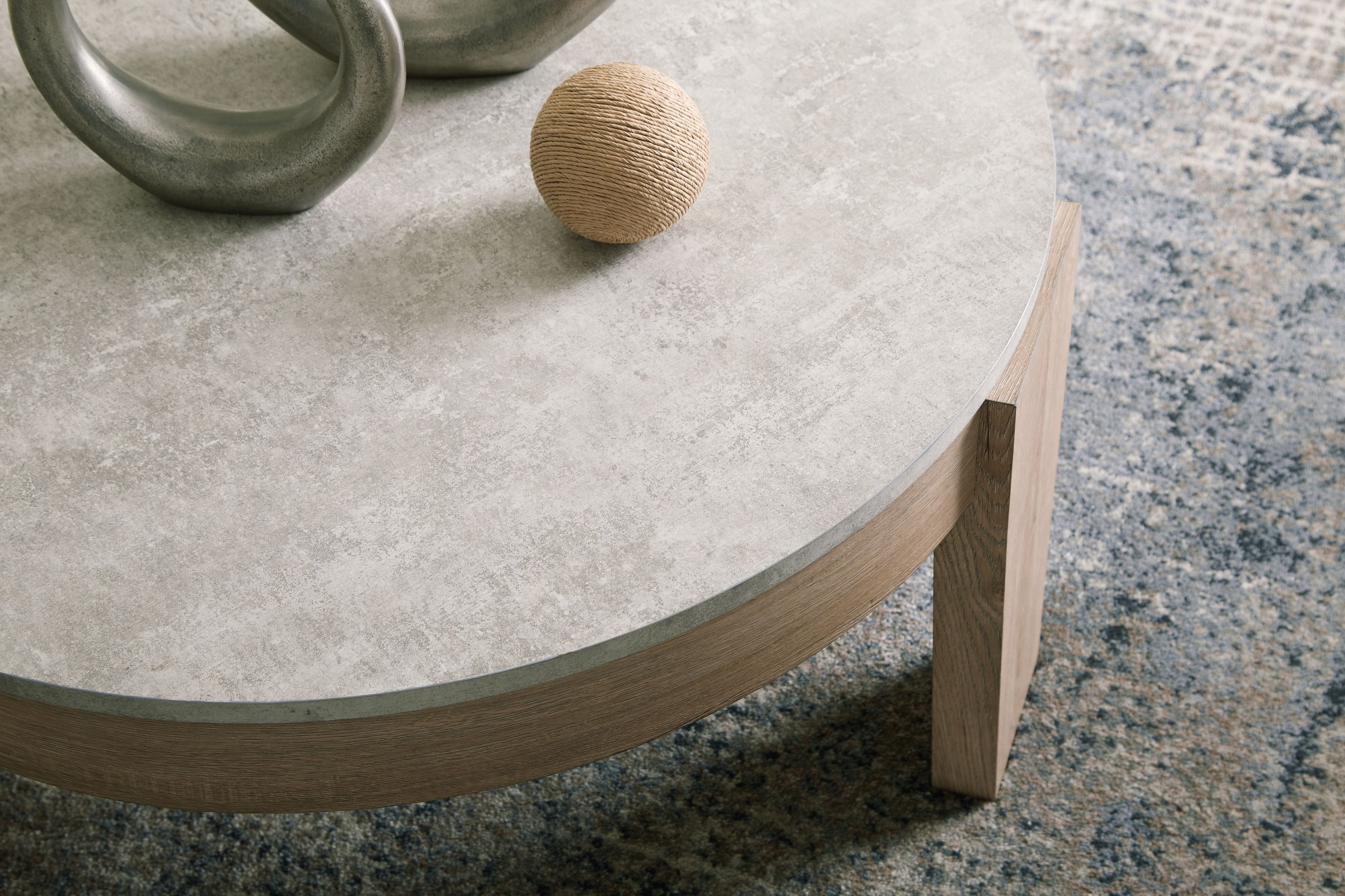 Gray round tabletop with light brown wooden legs