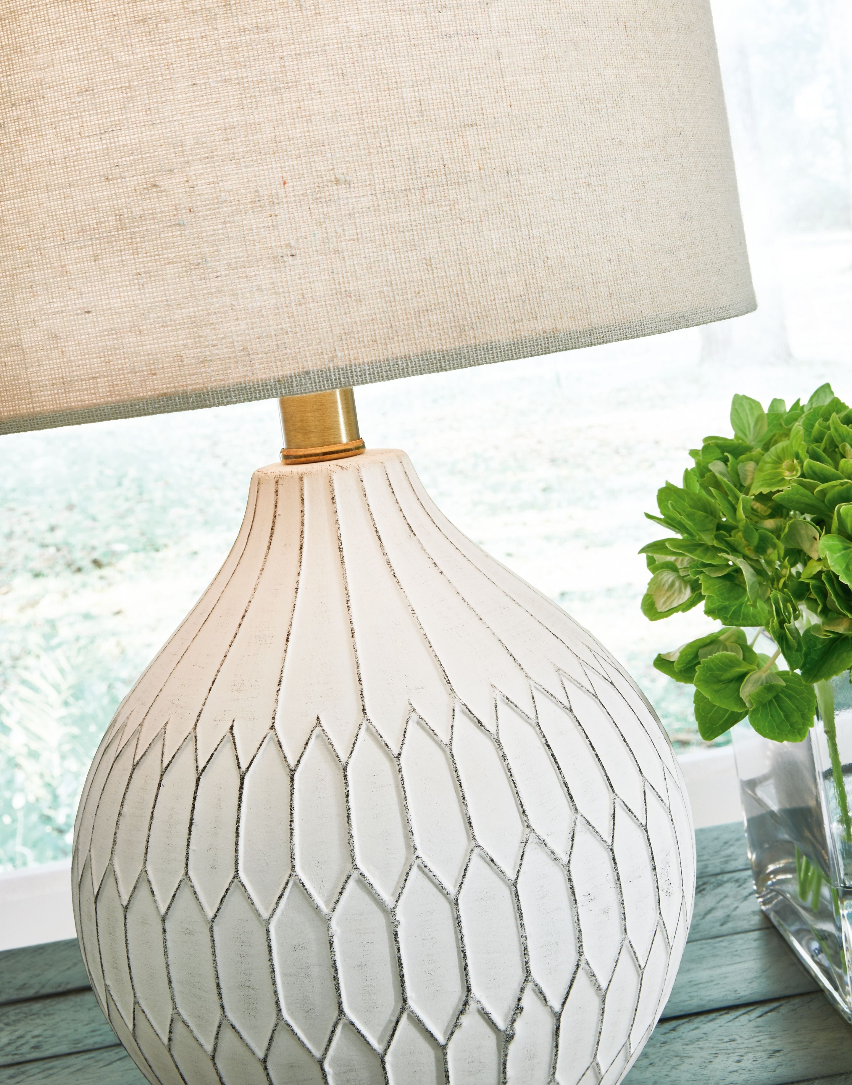 Ceramic table lamp close-up: white fabric shade and white diamond mesh ceramic body