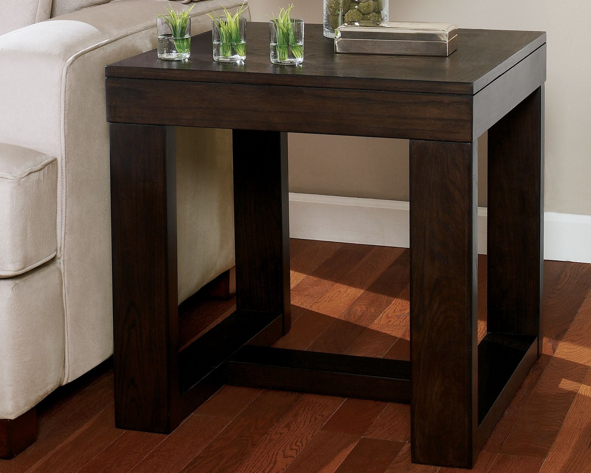 Square end table in dark brown wood with open base and tabletop