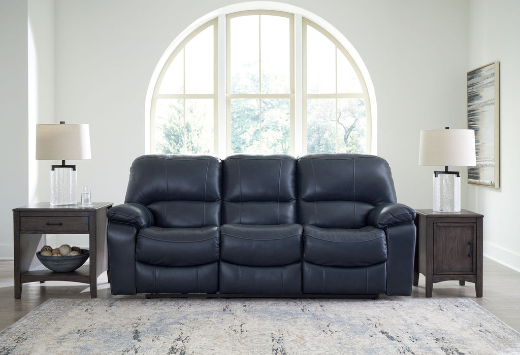Power reclining sofa with dark navy leather-look upholstery and padded armrests