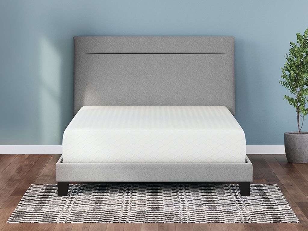 White memory foam mattress with textured top and gray base frame