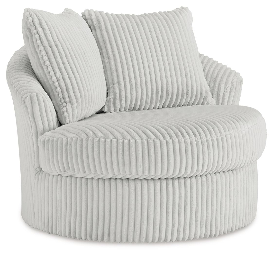 Swivel chair with ribbed light upholstery, rolled arms, and two back cushions