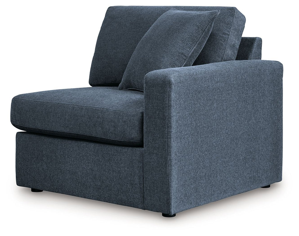Dark navy upholstered corner chair with two back cushions and rolled right arm