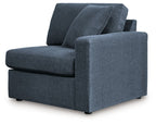 Dark navy upholstered corner chair with two back cushions and rolled right arm