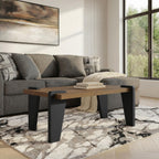 Rectangular coffee table with wood top, black legs, and top corner blocks in living room setting