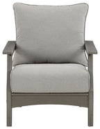 Gray lounge chair with tall back and seat cushions, squared wooden arms