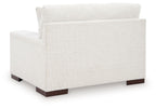 Frosted chair and a half with tall back, light textured upholstery, dark legs