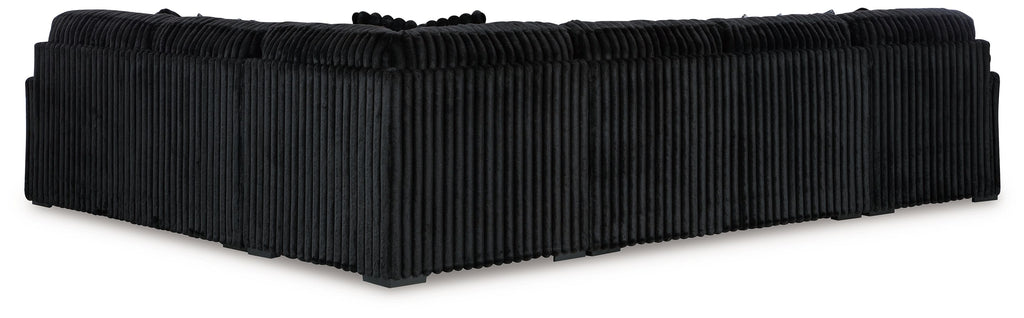 Black corduroy chaise sectional with ribbed arms and back cushions