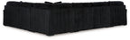 Black corduroy chaise sectional with ribbed arms and back cushions