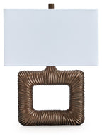 Metal table lamp base with antique brass ribbed square frame and white fabric shade