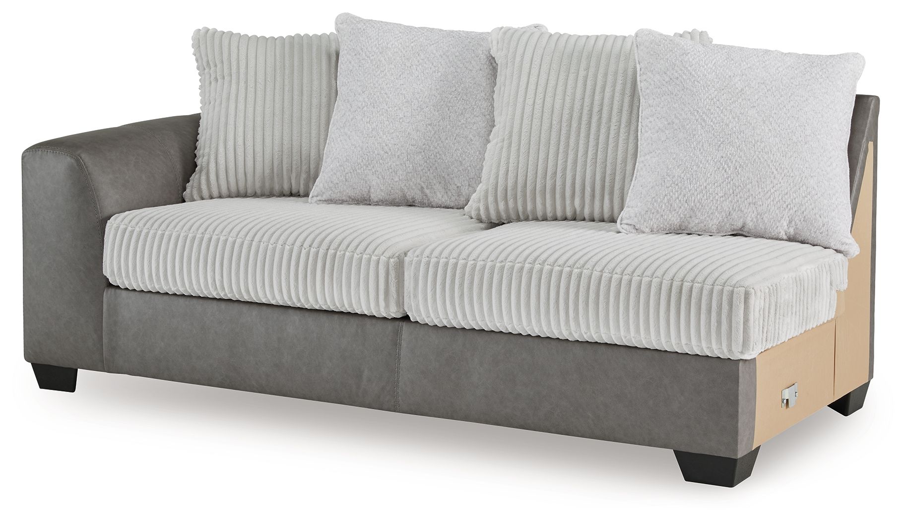 Grey upholstered sofa with ribbed back cushions and two light accent pillows