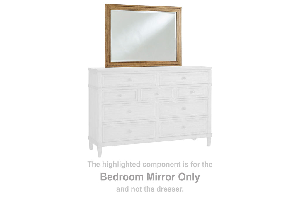 Small rectangular brown wood bedroom mirror with clear glass above dresser
