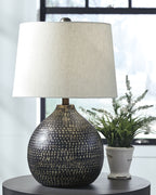 Metal table lamp with white shade and black textured gold-speckled base