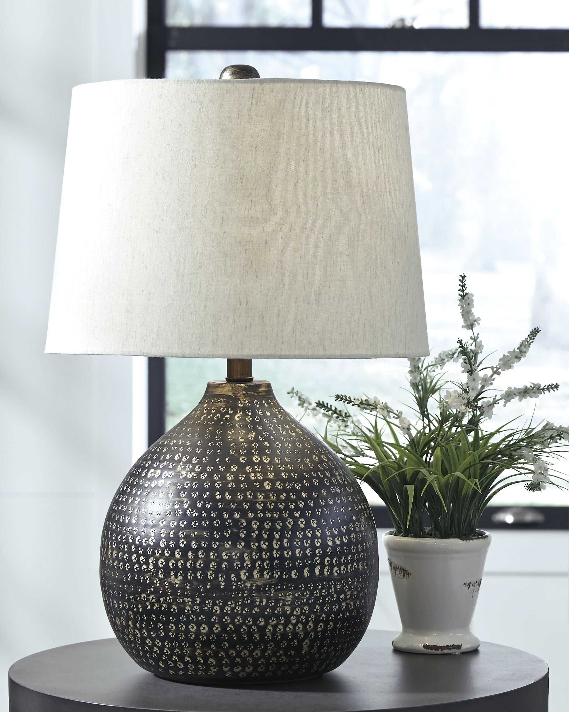 Metal table lamp with white shade and black textured gold-speckled base